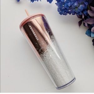 Pinkish rose gold and white Starbucks cup